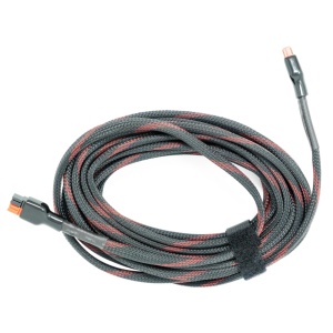 A Lion Energy 25' 30A 12V DC Anderson Extension Cord with a red plug.