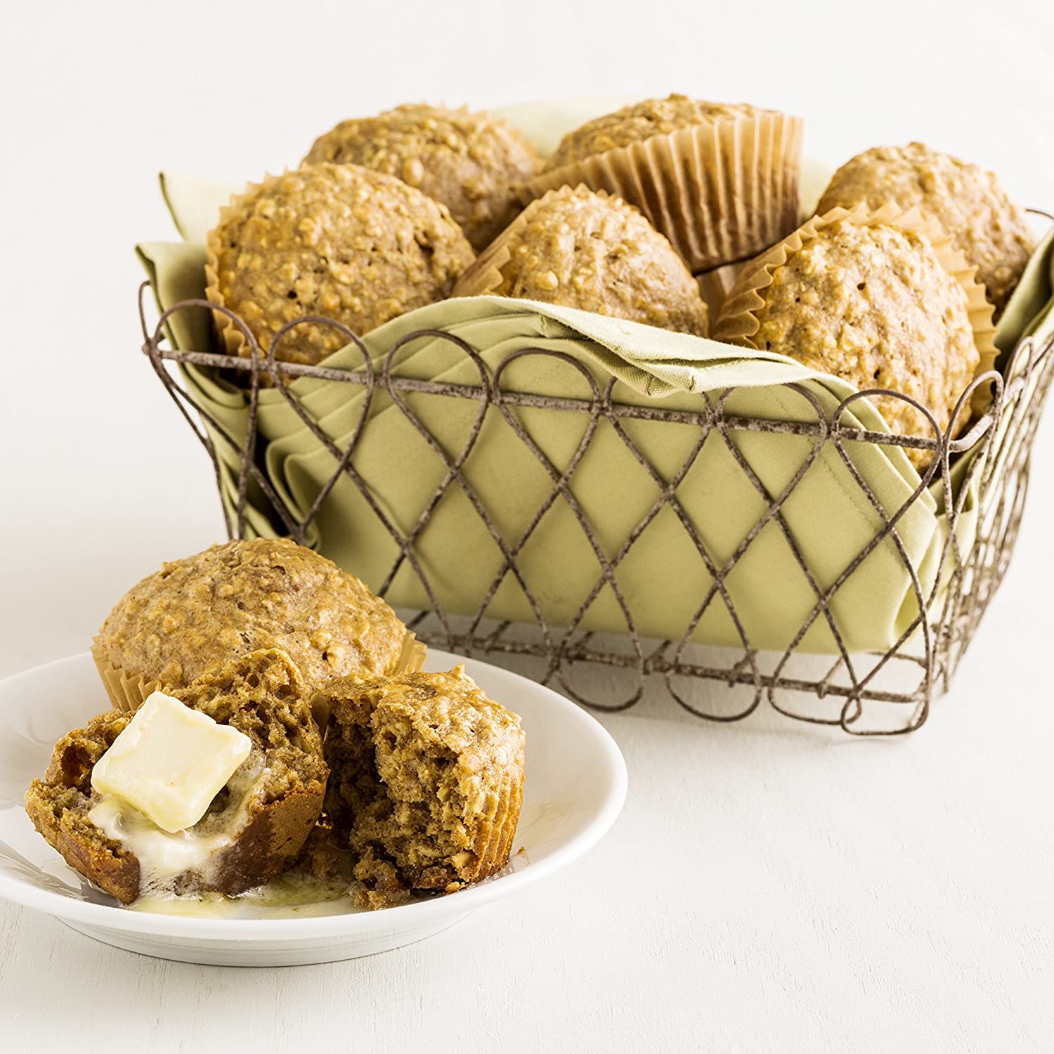 Oatmeal muffins in a basket with Augason Farms Quick Oats.