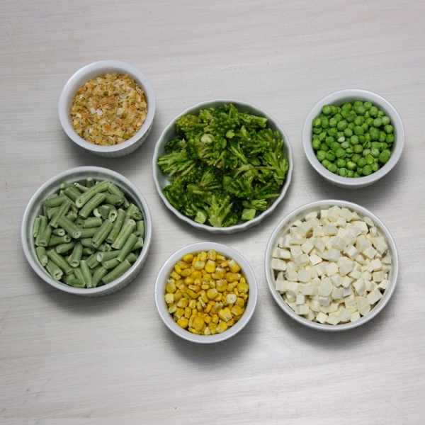 Different types of Augason Farms Freeze-Dried Vegetable Variety Pail - 109 Servings - (SHIPS IN 1-2 WEEKS) in white bowls.