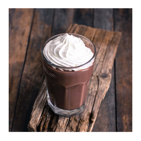 A cup of *Augason Farms Chocolate Morning Moo's Low Fat Milk - 57 Servings - (SHIPS IN 1-2 WEEKS) with whipped cream on a wooden table.