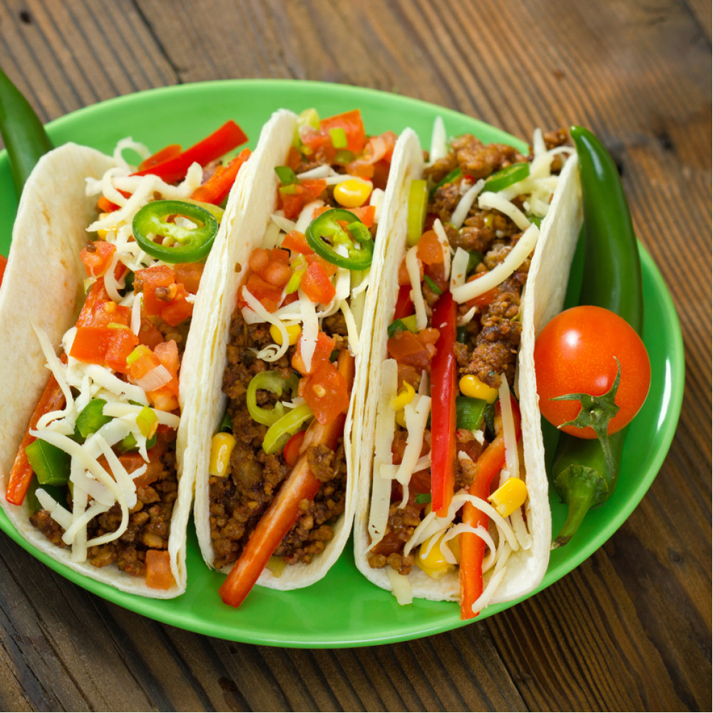 Green plate with Augason Farms Taco Flavored Vegetarian Meat Substitute TVP 30 Servings - (SHIPS IN 1-2 WEEKS) on it.