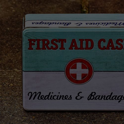 A box with the words first aid case on it.