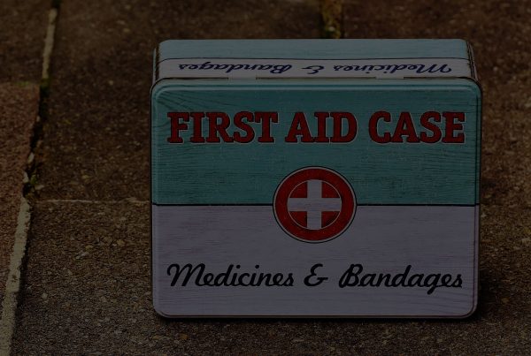 A box with the words first aid case on it.