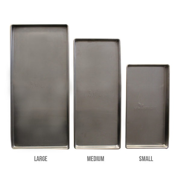 A set of four stainless steel baking pans in different sizes.