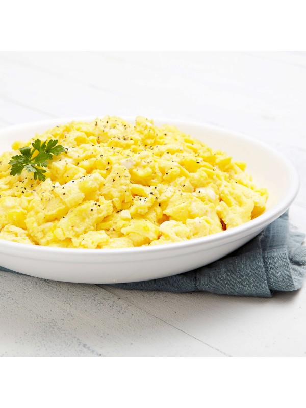 A bowl of Augason Farms Dried Whole Egg Powder 383 Servings 4 Gallon Pail - (SHIPS IN 1-2 WEEKS) with parsley.