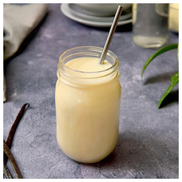 A nutrient-dense vanilla shake in a mason jar, suitable for vegetarians and those following a gluten-free diet, with 15 servings per jar.
