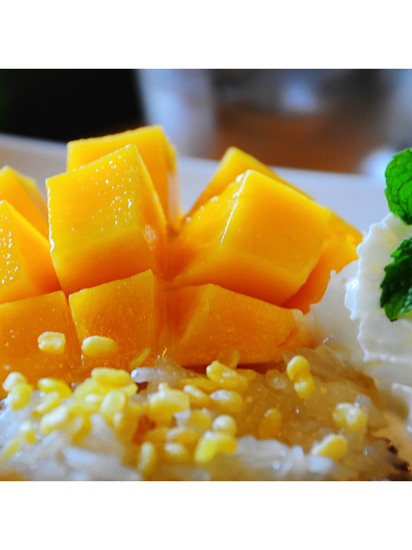 A plate of rice and Augason Farms Freeze-Dried Diced Mango #10 Can 15 Servings - (SHIPS IN 1-2 WEEKS) on a white plate.