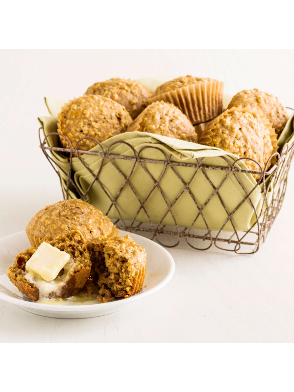 A basket of Augason Farms Quick Rolled Oats 4 Gallon Pail 108 Servings - (SHIPS IN 1-2 WEEKS) muffins with butter on a plate.