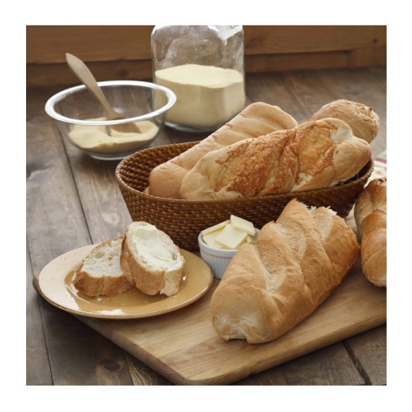 *Augason Farms Honey White Bread, Scone and Roll Mix 49 Servings - (SHIPS IN 1-2 WEEKS) and butter on a wooden cutting board.
