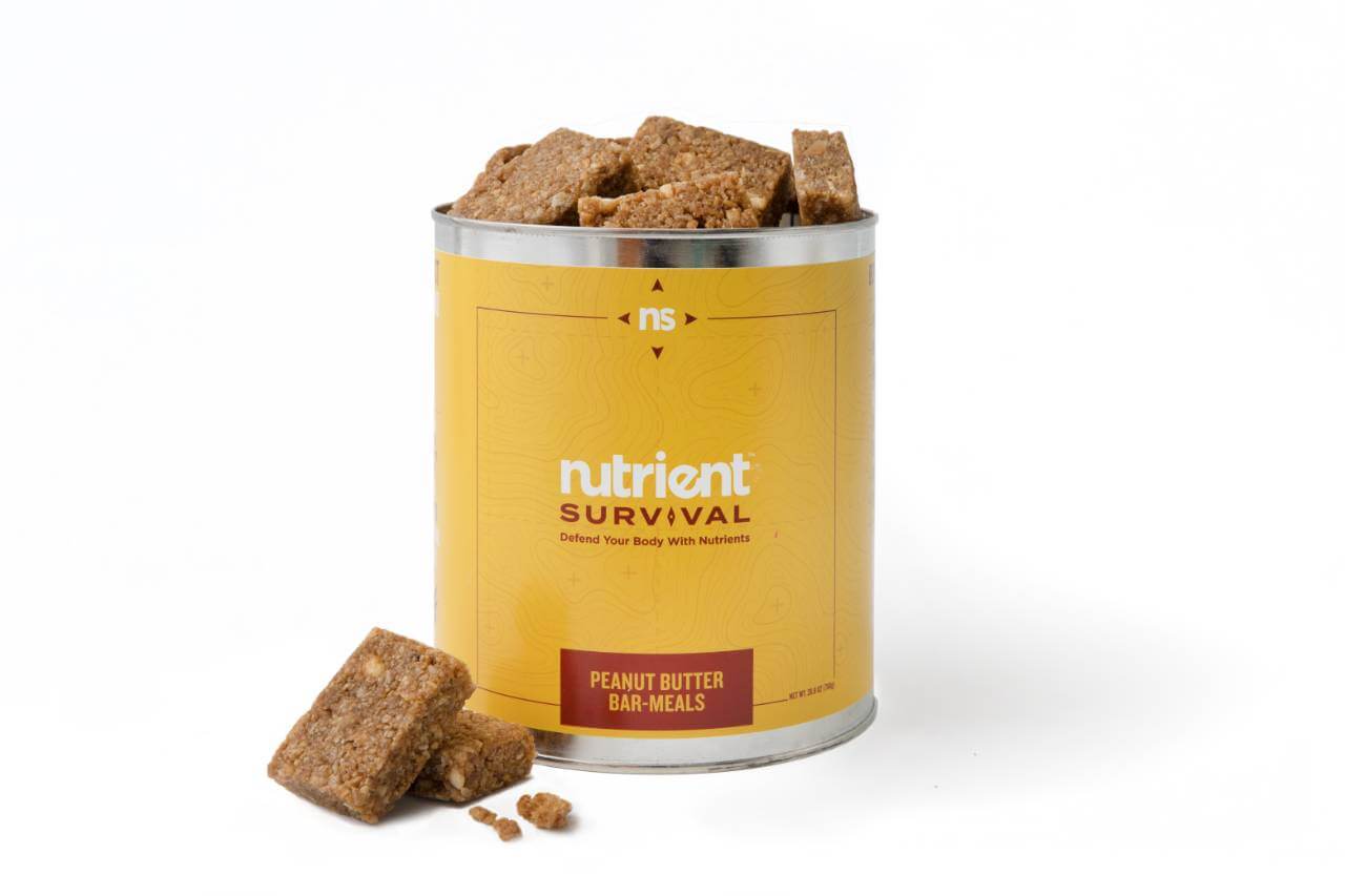 A tin with a Nutrient Survival Peanut Butter Bar Meals #10 Can 10 Servings - (SHIPS IN 2-4 WEEKS) of food in it.