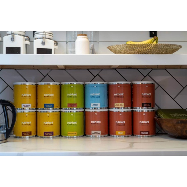 A kitchen with a variety of *Nutrient Survival Powdered Vitamin Milk #10 Cans 60 Servings - (SHIPS IN 2-4 WEEKS) on the counter.