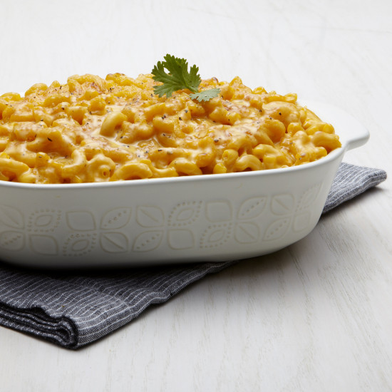 Macaroni and cheese *Augason Farms One Year Bucket Kit for One Person - 12 Pails - (SHIPS IN 1-2 WEEKS) in a white dish.