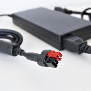 A Lion Energy Safari LT Fast Charger with a red and black cord.