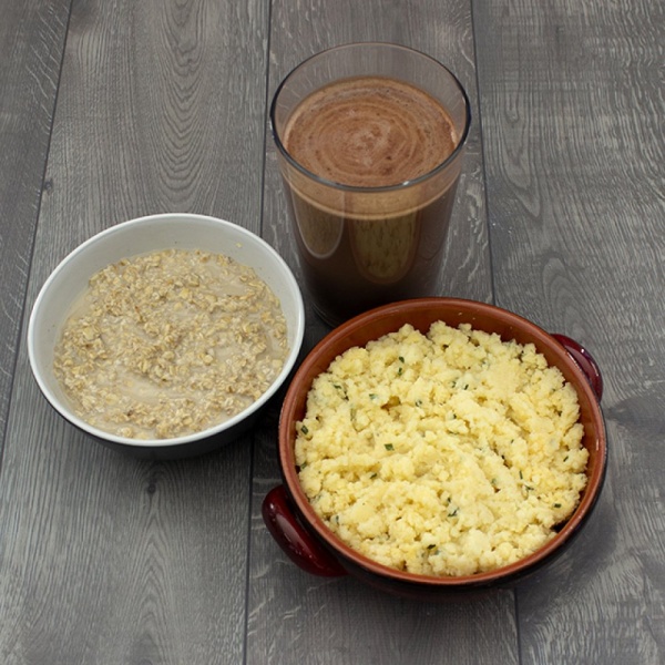 A bowl of rice, a bowl of oatmeal, and a cup of Augason Farms READY 24-Hour 1-Person Emergency Food Supply READY NOW (Homestyle Potatoes) - (SHIPS IN 1-2 WEEKS).