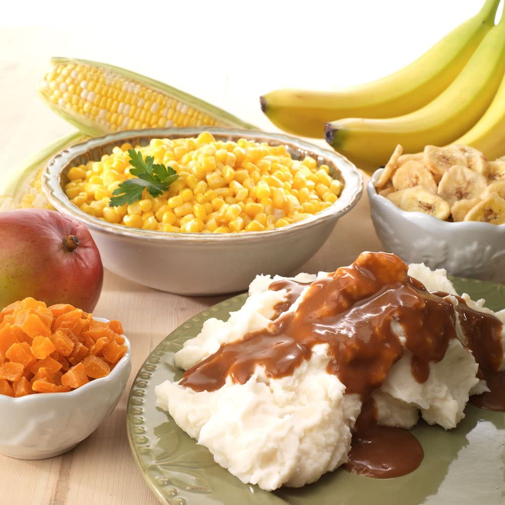 A plate with Legacy Food Storage Emergency Food Ultimate Sample Pack - Survival Supply - 183 Large Servings - (SHIPS IN 1-2 WEEKS), mashed potatoes, corn, apples and bananas.