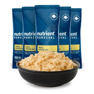 Nutrient Survival Triple Cheese Mac SINGLES in a bowl next to a pack of pouches.