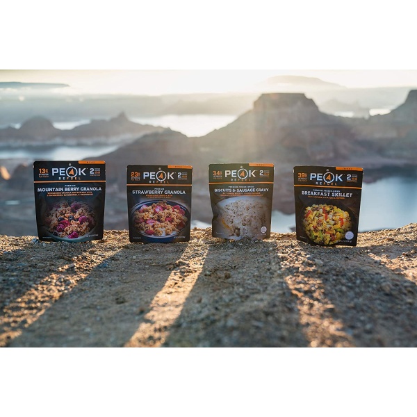 Three Peak Refuel Freeze-Dried Breakfast Sampler Food Storage and Backpacking Food Kit - (SHIPS IN 1-2 WEEKS) sitting on top of a mountain.