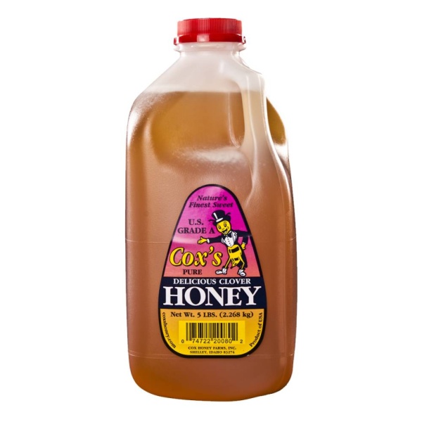 A gallon of Cox's Honey Gluten-Free Liquid Honey Cox Grade a 5 lbs Pail - 108 Servings - (SHIPS IN 1-4 WEEKS) on a white background.