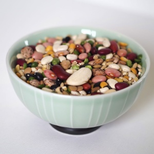 A bowl full of Rainy Day Foods Gluten-Free 16 Bean Mix 6 (Case of Six) #10 Cans - 156 Servings – (SHIPS IN 1-2 WEEKS), peas and nuts.