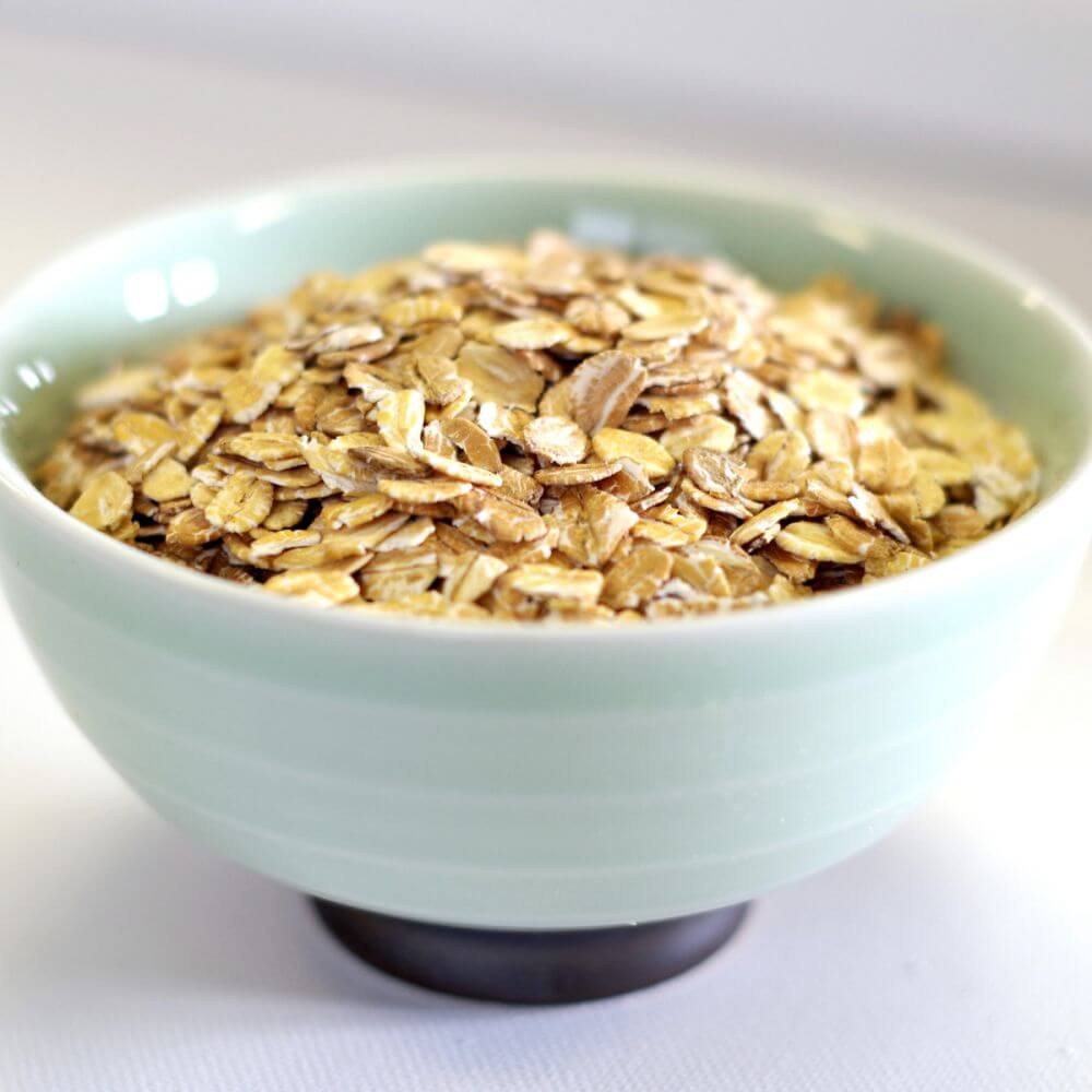 Emergency food storage options include oats in a bowl on a white surface.