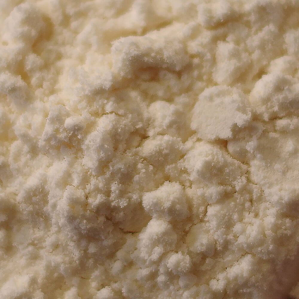 A close up of a bowl of white flour, ideal for emergency food storage.