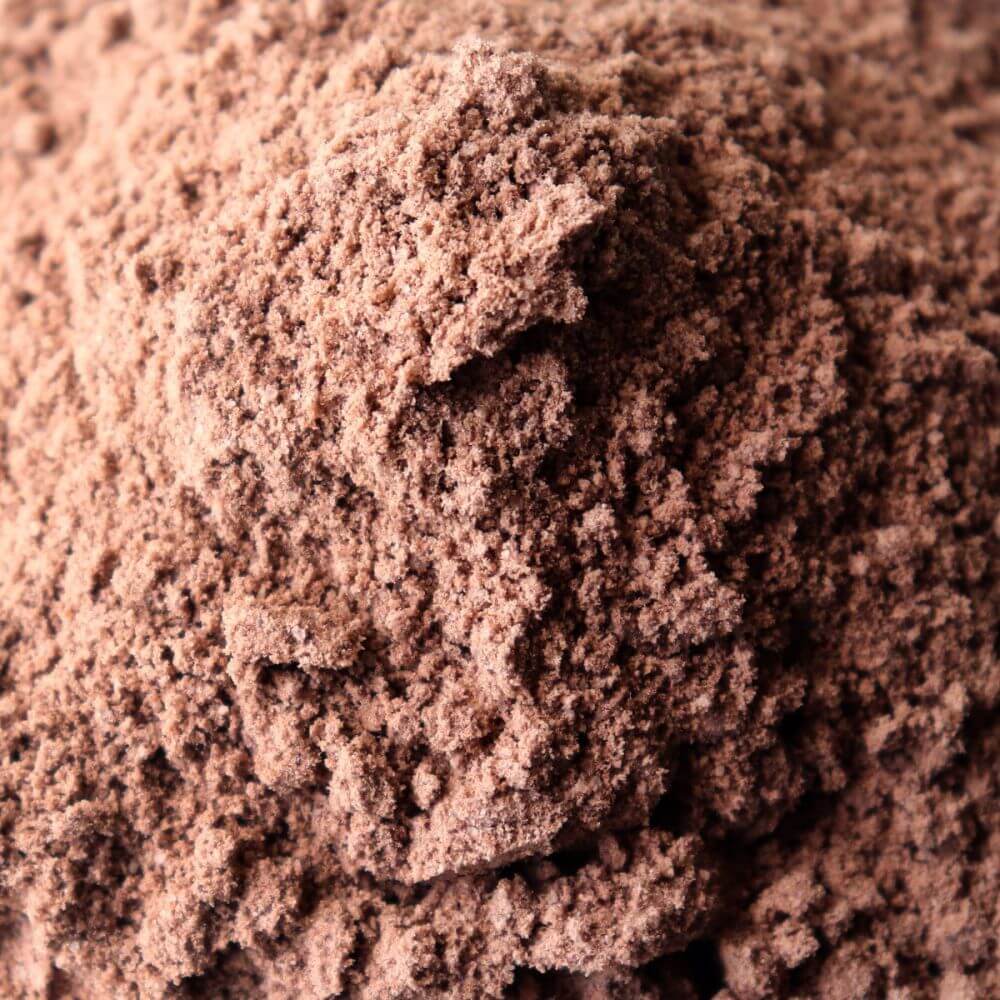 A close up of a pile of chocolate powder.