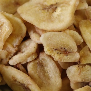 A close up of banana chips in a bowl.