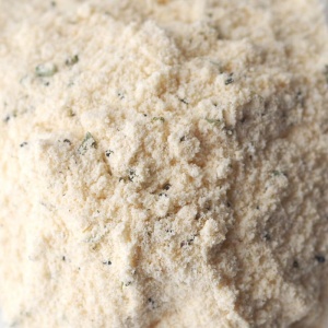 A pile of flour on a white plate.
