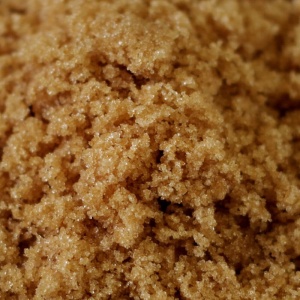 A close up of brown sugar on a table.