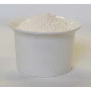 White powder in a bowl on a white surface.