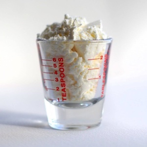 Whipped cream in a shot glass.