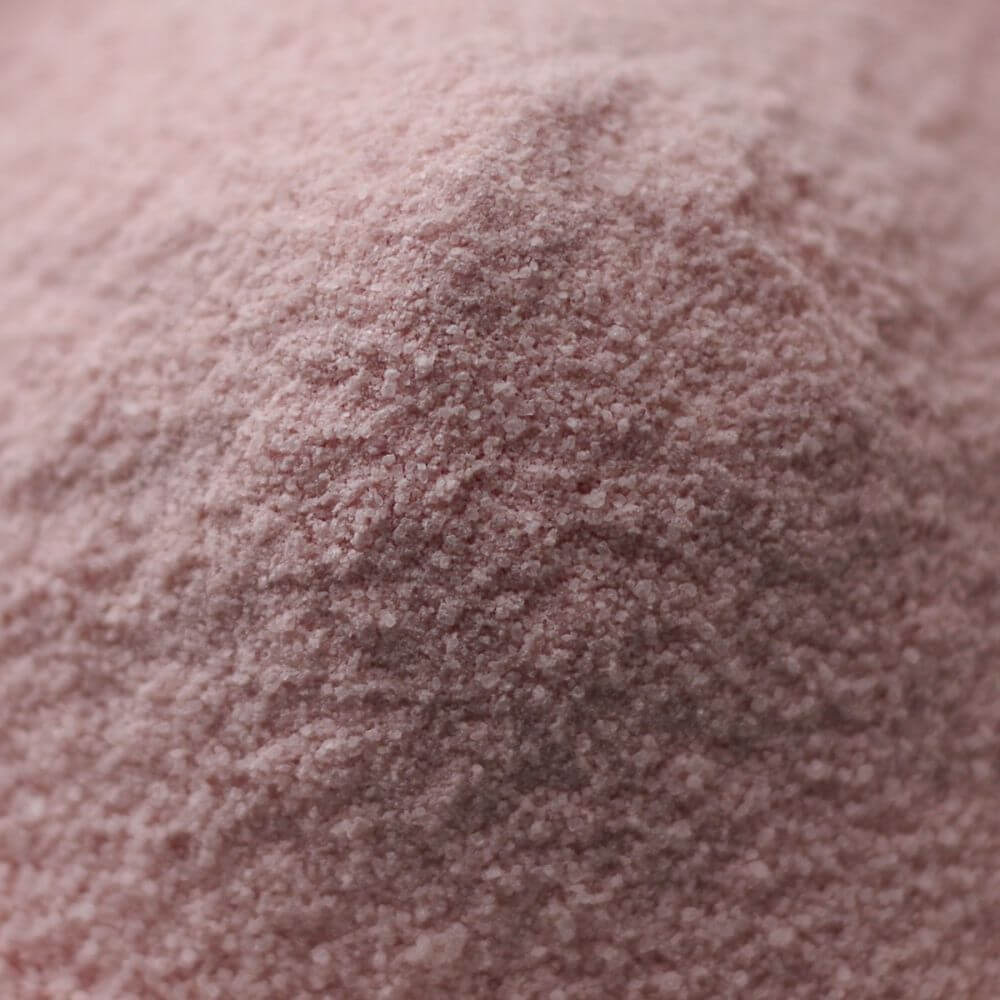 A close up of a pink powder.