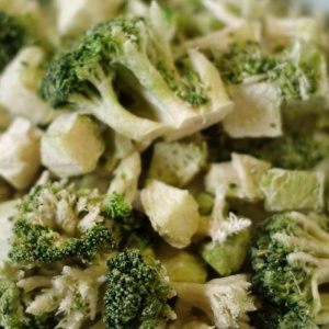 A close up of broccoli in a bowl.