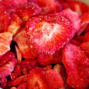 A close up of strawberries in a bowl.