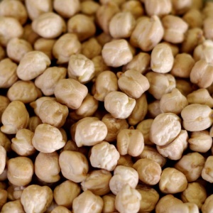 A pile of chickpeas on a table.