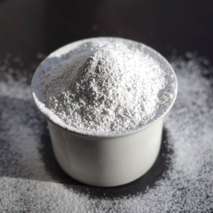 White powder in a cup on a table.