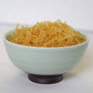 A bowl of yellow rice in a white bowl.