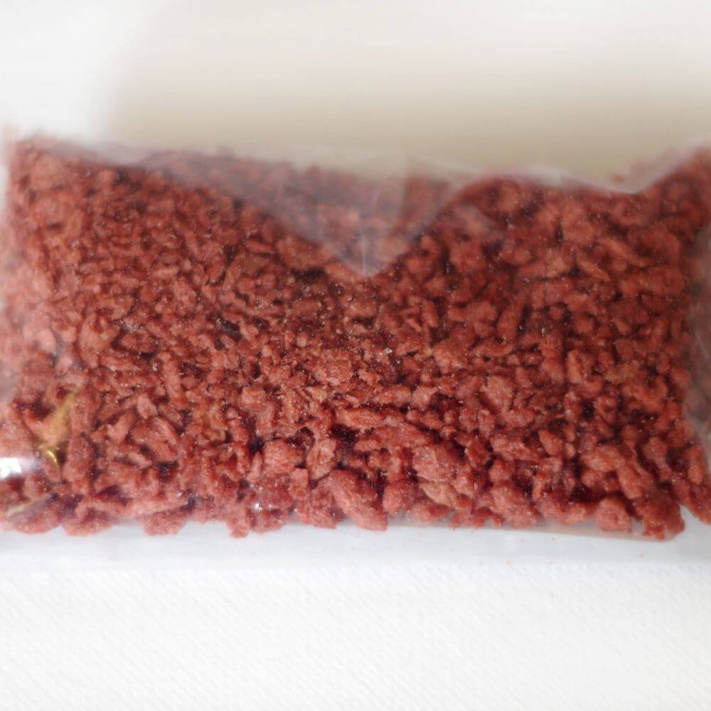 A bag of red meat in a plastic bag.