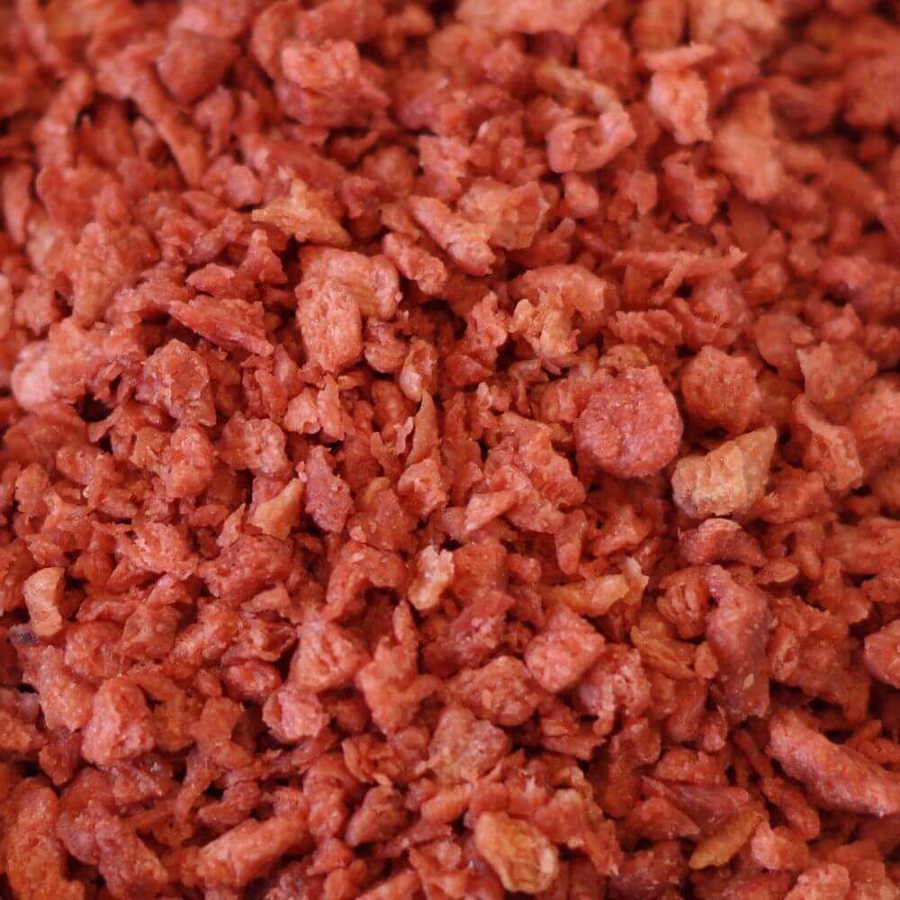 A close up of a pile of red meat.