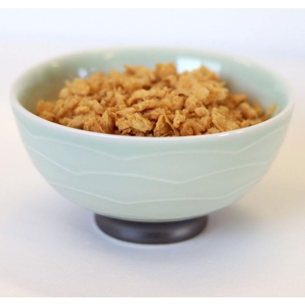 A bowl of granola in a white bowl.