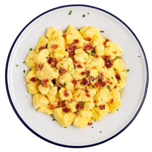 Mountain House Scrambled Eggs with Bacon Mylar Pouch - 1 Serving - (SHIPS IN 1-2 WEEKS) with bacon and chives on a plate.