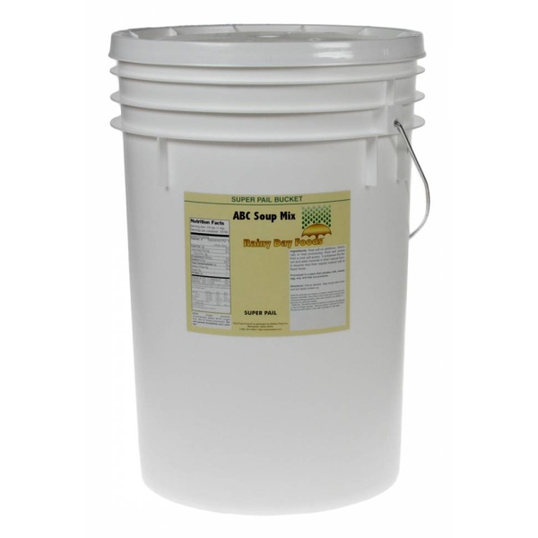 A white bucket with a white label on it, containing Rainy Day Foods ABC Soup Mix 5 Gallon Super Pail.