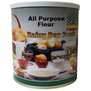 A 64 oz tin of Rainy Day Foods Non-GMO All Purpose Flour on a white background.