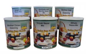 Assorted canisters filled with Rainy Day Foods seasoning and sauce packs.