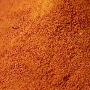 A close up of a pile of red emergency food storage powder.