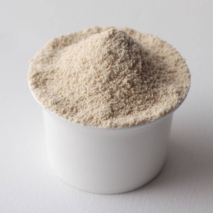 A bowl of powder for emergency food storage on a surface.