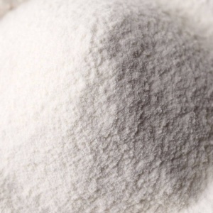 A pile of white powder for emergency food storage on a white background.
