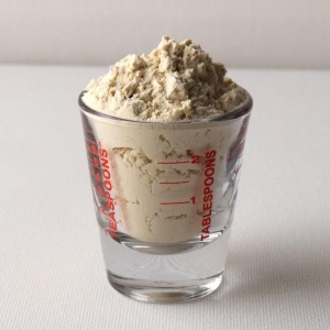A shot glass with a scoop of granola, perfect for emergency food storage, is available.