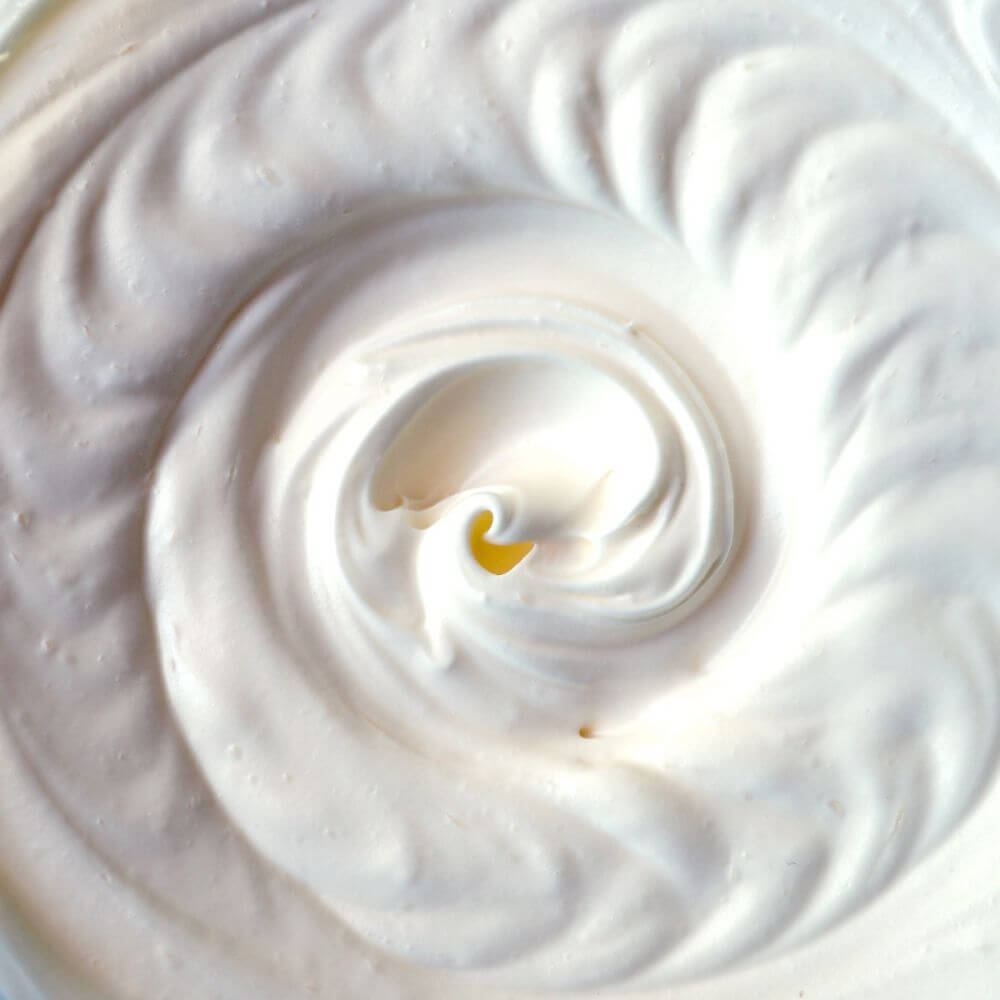 A close up of whipped cream in a bowl, perfect for emergency food storage.