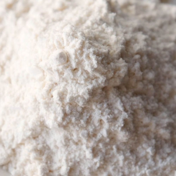 A pile of flour for emergency food storage on a white plate.